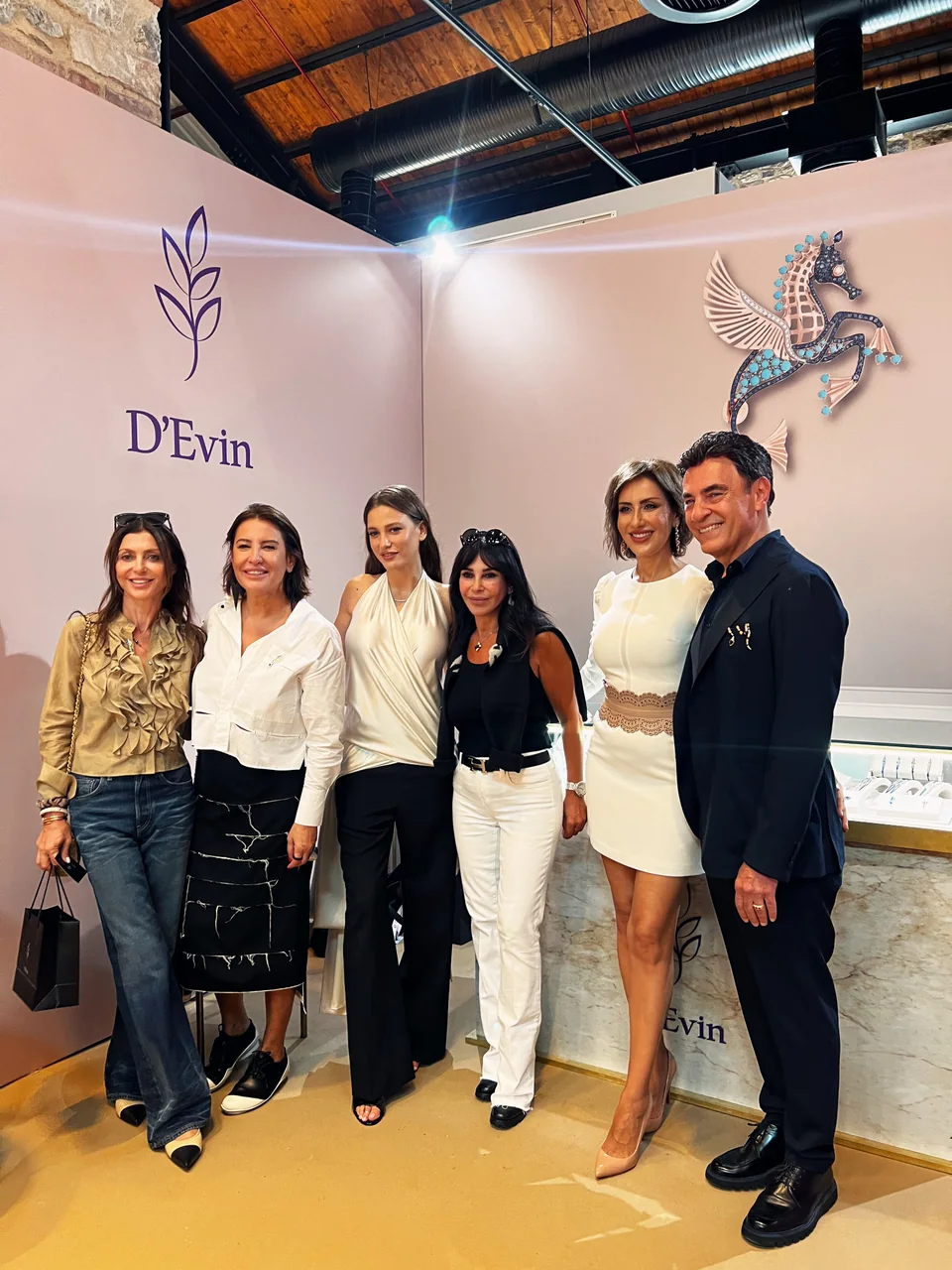 A group photograph at the D’Evin stand at Contemporary Istanbul.